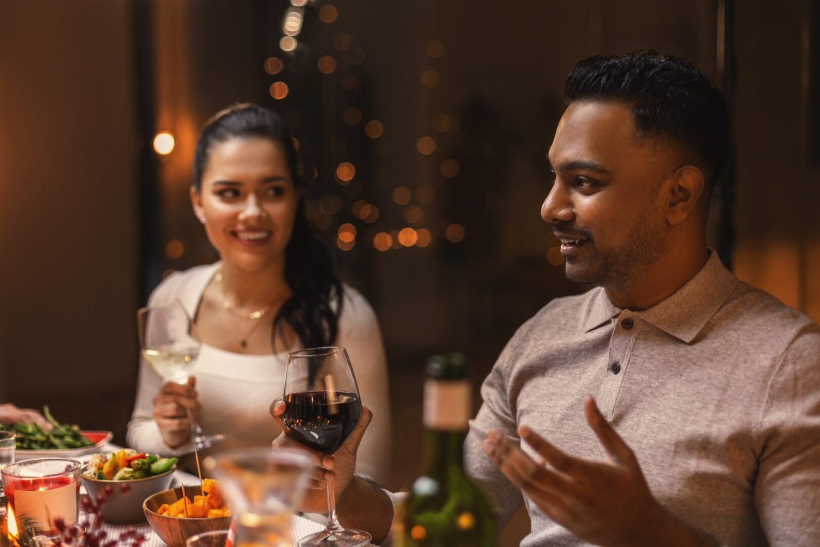 A man and woman are sitting at the table